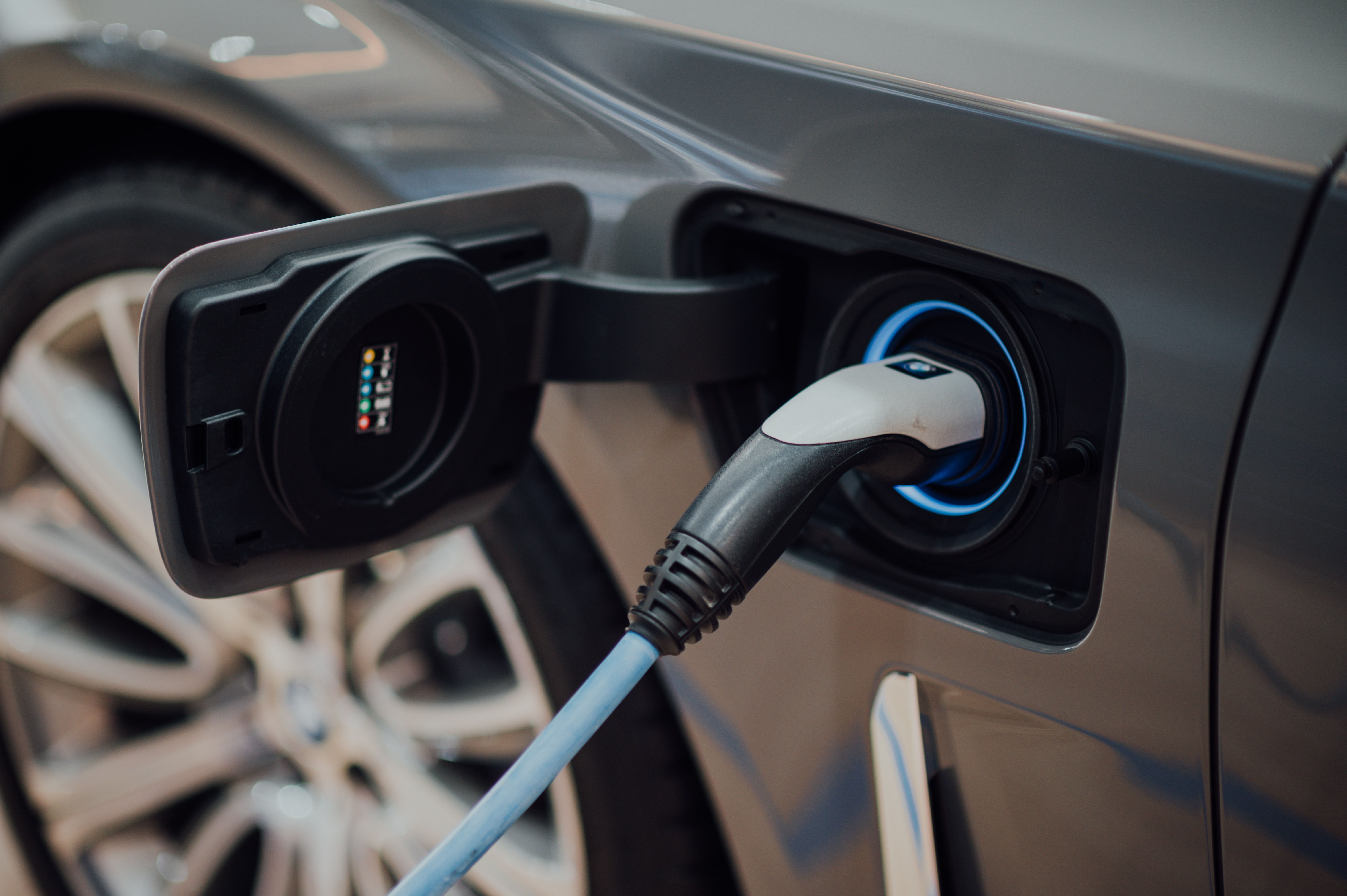 electric vehicle charging station Photo by CHUTTERSNAP on Unsplash